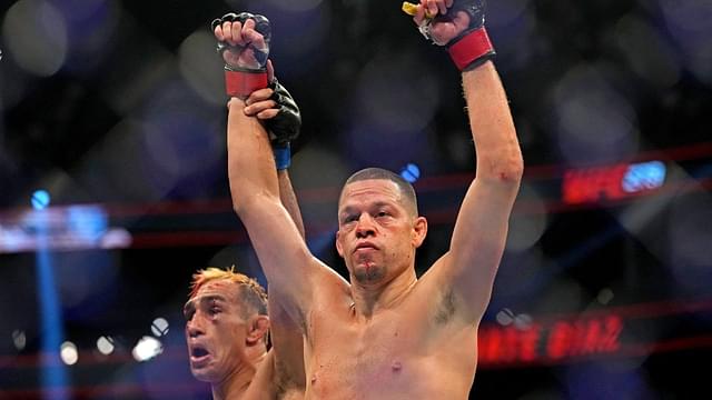 Nate Diaz (red gloves) fights Tony Ferguson (blue gloves) during UFC 279 at T-Mobile Arena.