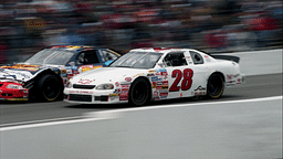 Pole-sitter Casey Atwood (28) surges past a slower car as he stretches his lead during the early part of the Busch Series' BellSouth/Opryland 320 at the Nashville Speedway March 15, 1998. Atwood, who at 17 became the youngest pole-sitter in the 17-year history of the NASCAR Busch Series, finished runner-up in the nationally televised race.