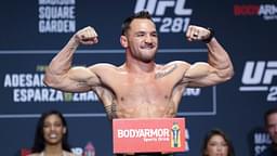 ; Michael Chandler gestures during weigh-ins for UFC 281.