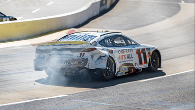 Xfinity 500 driver, DENNY HAMLIN (11) of Chesterfield, VA, brings out the caution as he wrecks during a practice session for the Xfinity 500 at Martinsville Speedway in Ridgeway, VA.