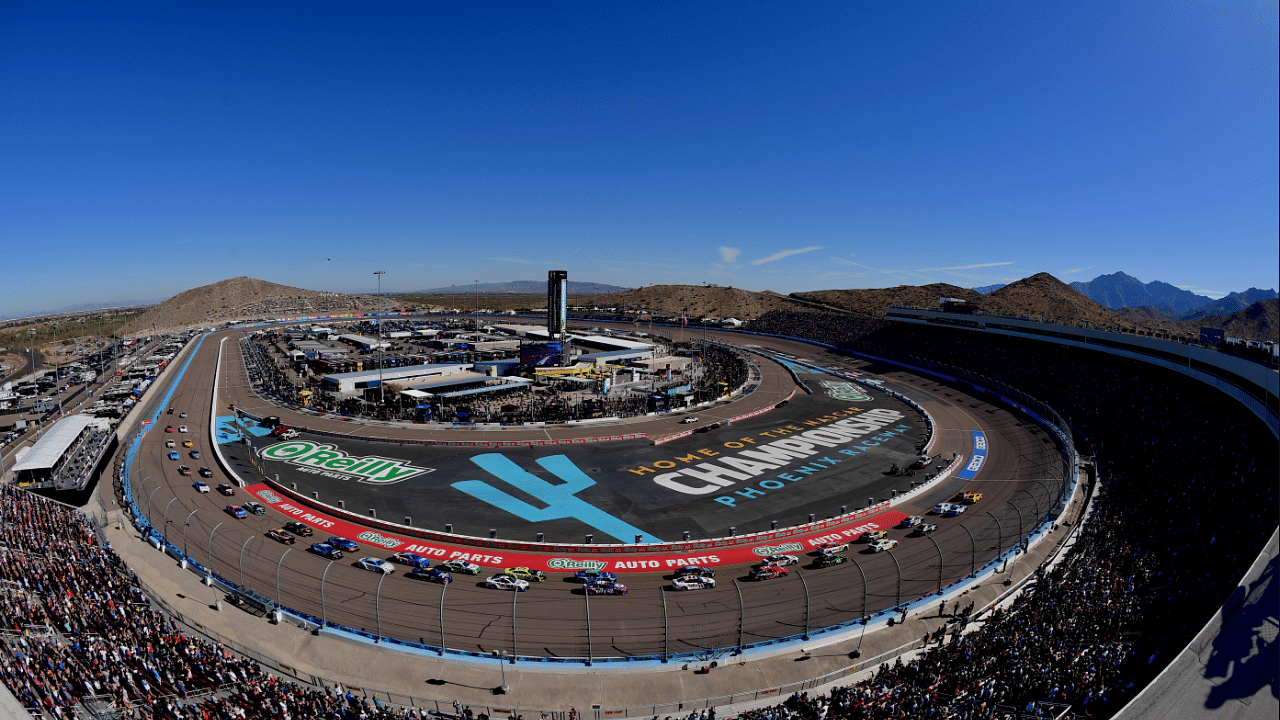 NASCAR Cup Series driver Martin Truex Jr. (19) and driver Joey Logano (22) lead the field for the start during the Cup Series championship race at Phoenix Raceway.