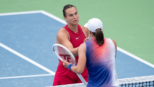 Aryna Sabalenka at the net with Iga Swiatek of Poland after their match on day seven of the Cincinnati Open.