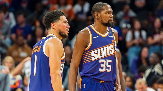 Phoenix Suns guard Devin Booker (1) and forward Kevin Durant (35) react after a time out late in the second half during a game against the Portland Trail Blazers at Footprint Center.