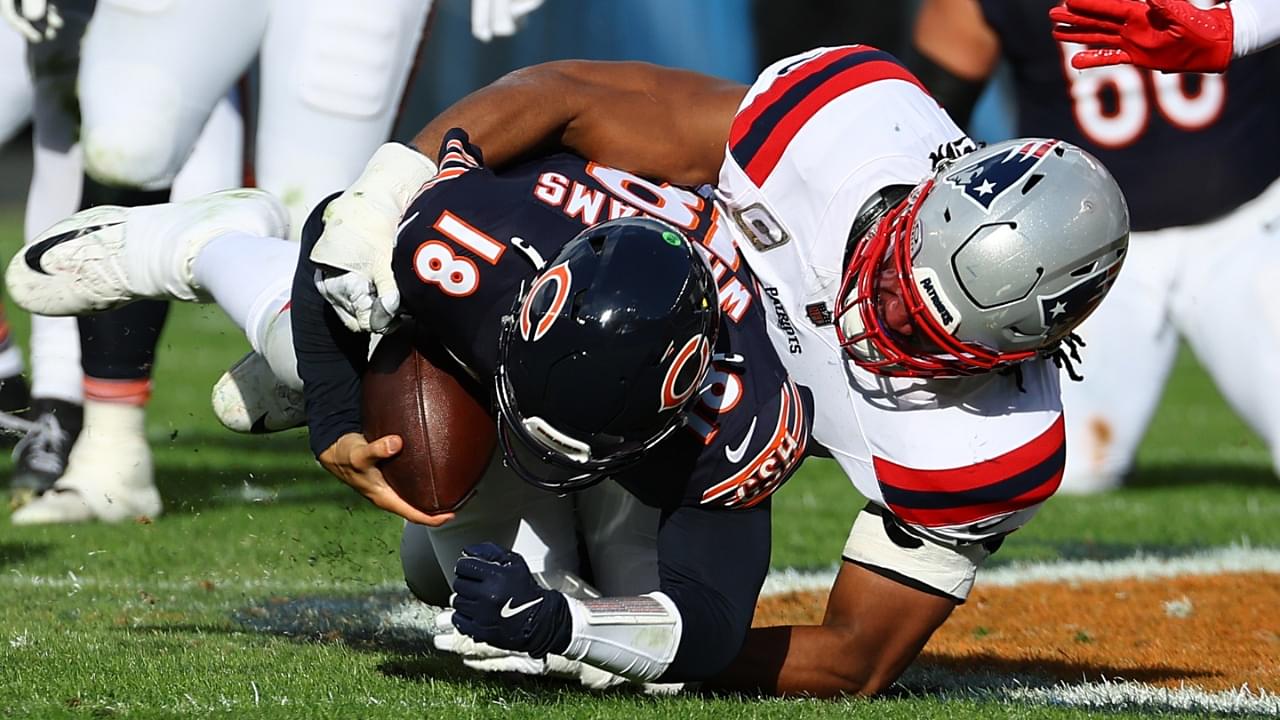 Nov 10, 2024; Chicago, Illinois, USA; New England Patriots defensive end Deatrich Wise Jr. (91) sacks Chicago Bears quarterback Caleb Williams (18) during the second half at Soldier Field.