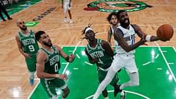 Dallas Mavericks guard Kyrie Irving (11) shoots the ball against Boston Celtics guard Jrue Holiday (4) in game five of the 2024 NBA Finals at TD Garden.