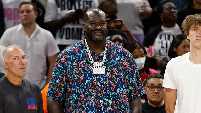 Former NBA player Shaquille O'Neal and Chicago Bulls 2024 NBA draft pick Matas Buzelis stand on the sidelines before a basketball game between the Chicago Sky and Indiana Fever at Wintrust Arena.