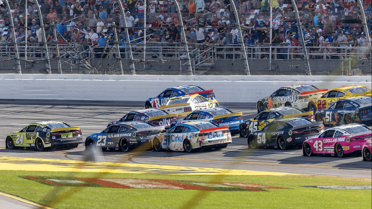 Ryan Blaney (12) crosses into Ross Chastain (1) creating a wreck in the final laps during the second stage of the YellaWood 500 at Talladega Superspeedway.