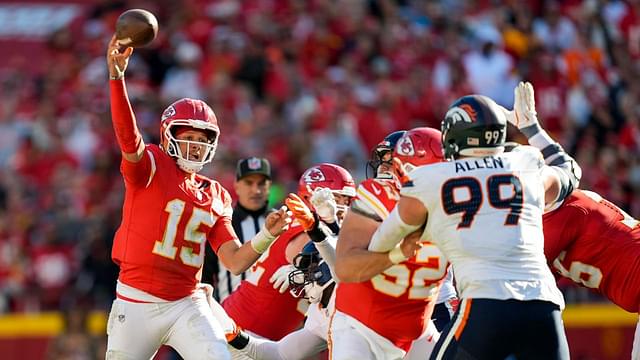 Kansas City Chiefs quarterback Patrick Mahomes (15) throws a pass against Denver Broncos defensive end Zach Allen (99) during the second half at GEHA Field at Arrowhead Stadium.