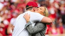 Oklahoma Sooners former player Baker Mayfield hugs his wife Emily as his statue is unveiled during the spring game at Gaylord Family Oklahoma Memorial Stadium.