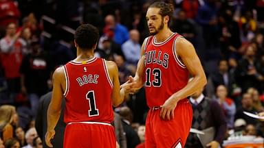 Chicago Bulls guard Derrick Rose (1) celebrates with Bulls center Joakim Noah (13) against the Washington Wizards in the fourth quarter at Verizon Center. The Bulls won 99-91.