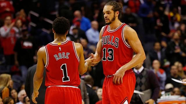 Chicago Bulls guard Derrick Rose (1) celebrates with Bulls center Joakim Noah (13) against the Washington Wizards in the fourth quarter at Verizon Center. The Bulls won 99-91.