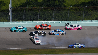 NASCAR Cup Series driver Corey LaJoie (7) spins in front of NASCAR Cup Series driver Kyle Busch (8) and NASCAR Cup Series driver Daniel Suarez (99) during the Straight Talk Wireless 400 at Homestead-Miami Speedway.