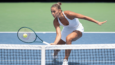 Marta Kostyuk of Ukraine returns a shot during her match against Iga Swiatek of Poland on day five of the Cincinnati Open.