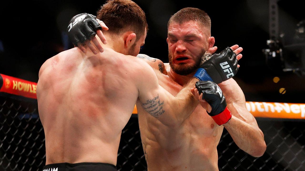 Serhiy Sidey (red gloves) fights Garrett Armfield (blue gloves) in a bantamweight bout during UFC Fight Night at Rogers Place.