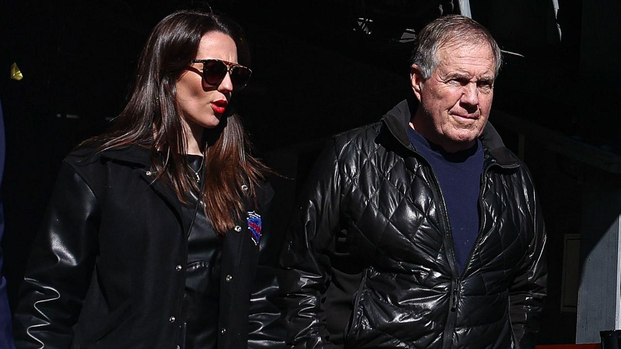 Former New England Patriots head coach Bill Belichick and girlfriend Jordon Hudson enter the field before the game between the Notre Dame Fighting Irish and the Navy Midshipmen at MetLife Stadium.