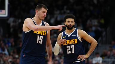 Apr 10, 2024; Denver, Colorado, USA; Denver Nuggets center Nikola Jokic (15) and guard Jamal Murray (27) talk in the fourth quarter against the Minnesota Timberwolves at Ball Arena. Mandatory Credit: Ron Chenoy-Imagn Images