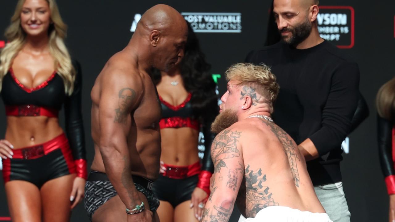 Jake Paul and Mike Tyson face off during weigh-ins at the Toyota Music Factory the day before their fight.