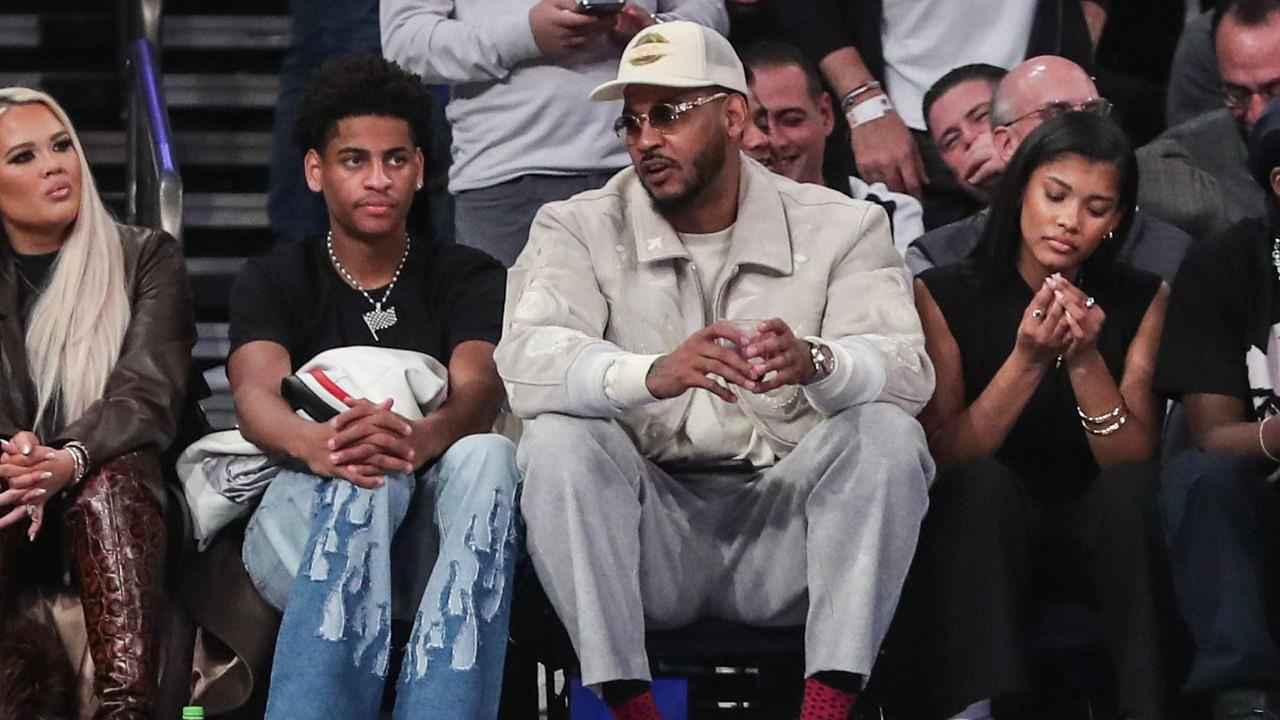 Former NBA player Carmelo Anthony (r) sits with his son Kiyan Anthony (l) at the game between the Boston Celtics and the New York Knicks at Madison Square Garden.