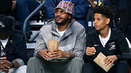 Carmelo Anthony and his son, Kiyan, watch the Don Bosco Prep Ironmen compete against the McEachern Indians in a game during the 50th annual City of Palms Classic at Suncoast Credit Union Arena in Fort Myers on Tuesday, Dec. 19, 2023. Kiyan Anthony and the Long Island Luthern Crusaders defeated Westminster Academy earlier in the day.