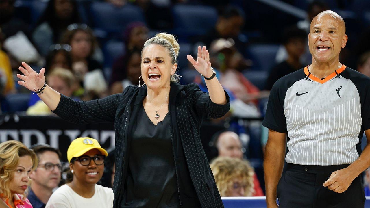 Las Vegas Aces head coach Becky Hammon (L) argues a call against her team with official Tim Greene (R) during the first half of a basketball game against the Chicago Sky at Wintrust Arena