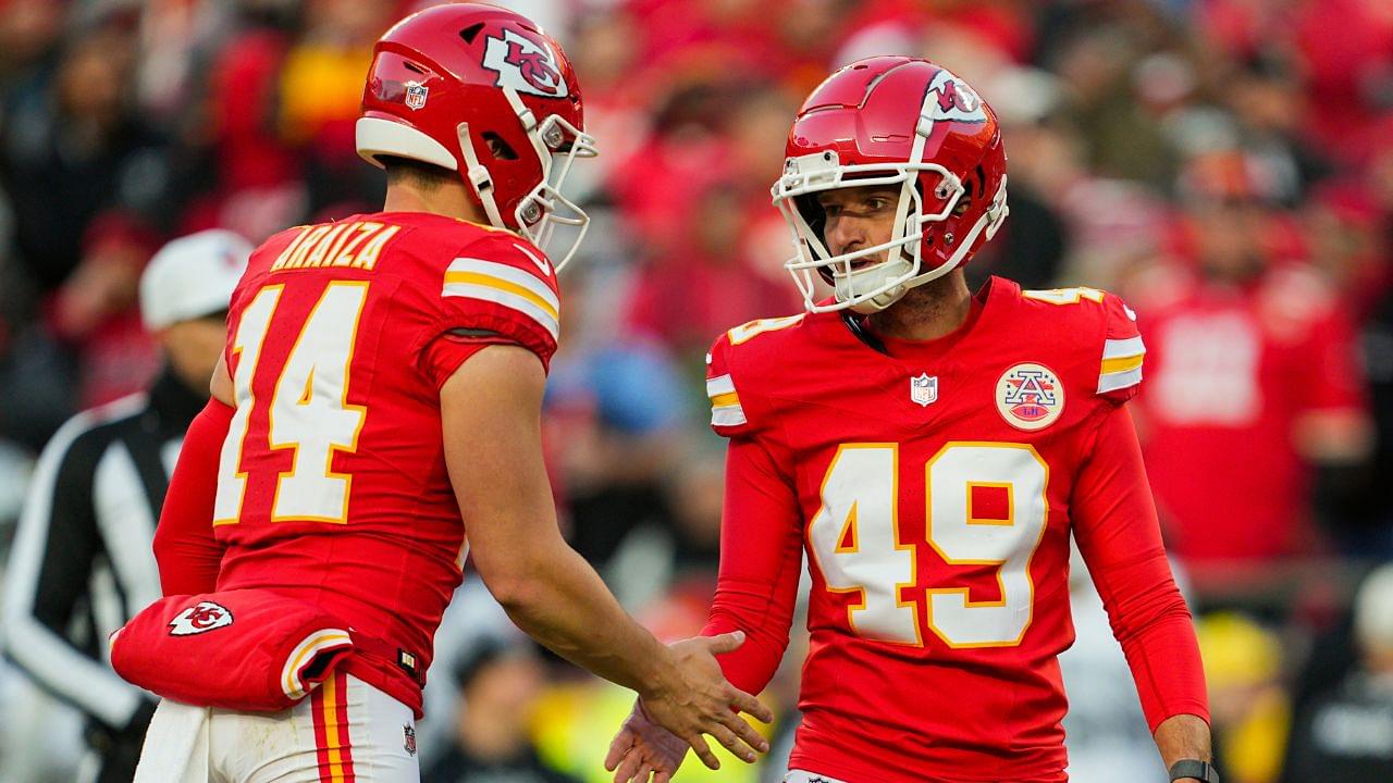 Kansas City Chiefs place kicker Matthew Wright (49) celebrates with punter Matt Araiza (14) after kicking a field goal during the second half against the Las Vegas Raiders at GEHA Field at Arrowhead Stadium.