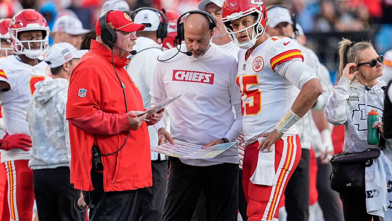 Kansas City Chiefs head coach Andy Reid talks with quarterback Patrick Mahomes (15) during a time out during the second half against the Carolina Panthers at Bank of America Stadium.