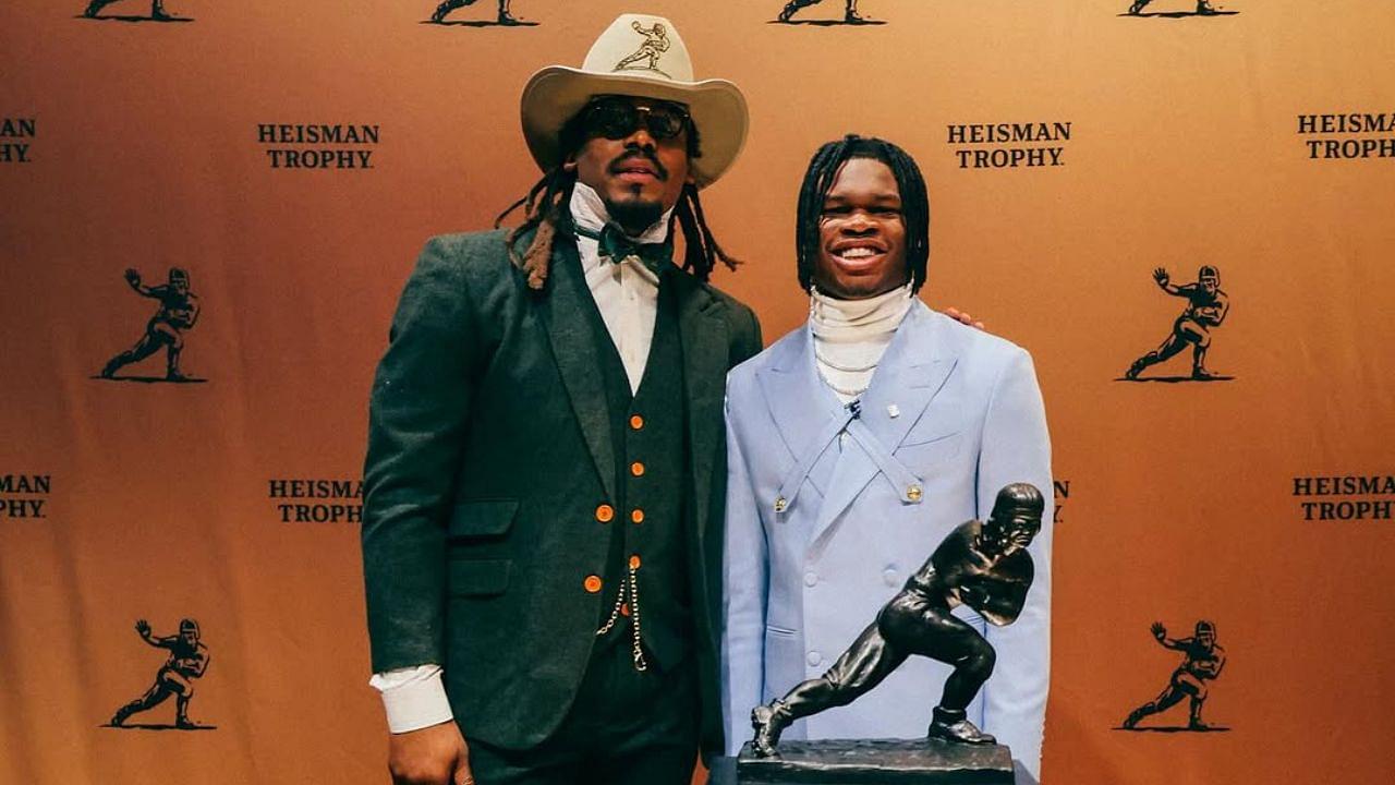 Cam Newton with Travis Hunter at the Heisman Trophy Ceremony.