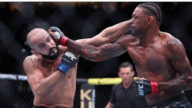 Michael Johnson (red gloves) fights Ottman Azaitar (blue gloves) at Amalie Arena.