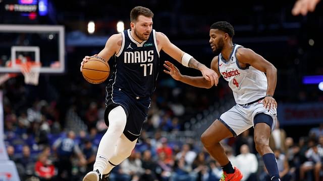 Dallas Mavericks guard Luka Doncic (77) drives to the basket as Washington Wizards guard Jared Butler (4) defends in the second quarter at Capital One Arena.