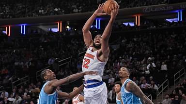 New York Knicks center Karl-Anthony Towns (32) shoots the ball while being defended by Charlotte Hornets forward Moussa Diabate (14) and Charlotte Hornets guard DaQuan Jeffries (3) during the second half at Madison Square Garden.