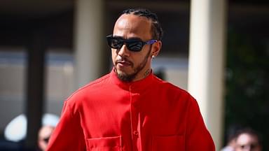 Lewis Hamilton of Mercedes dressed all in red arrives on the paddock on a race day of Formula 1 Abu Dhabi Grand Prix at Yas Marina Circuit