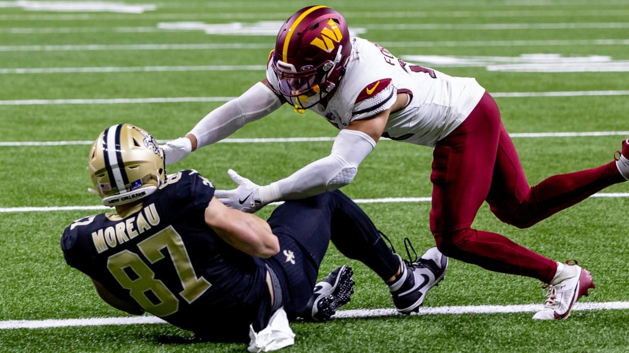 Dec 15, 2024; New Orleans, Louisiana, USA; New Orleans Saints tight end Foster Moreau (87) catches a touchdown pass to get within 1 point of he Washington Commanders during the second half at Caesars Superdome.