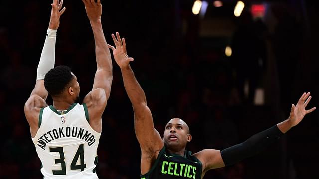 Milwaukee Bucks forward Giannis Antetokounmpo (34) shoot the ball over Boston Celtics center Al Horford (42) during the second half at TD Garden.