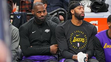 Los Angeles Lakers forward LeBron James (23) and forward Anthony Davis (3) on the bench against the Minnesota Timberwolves in the fourth quarter at Target Center