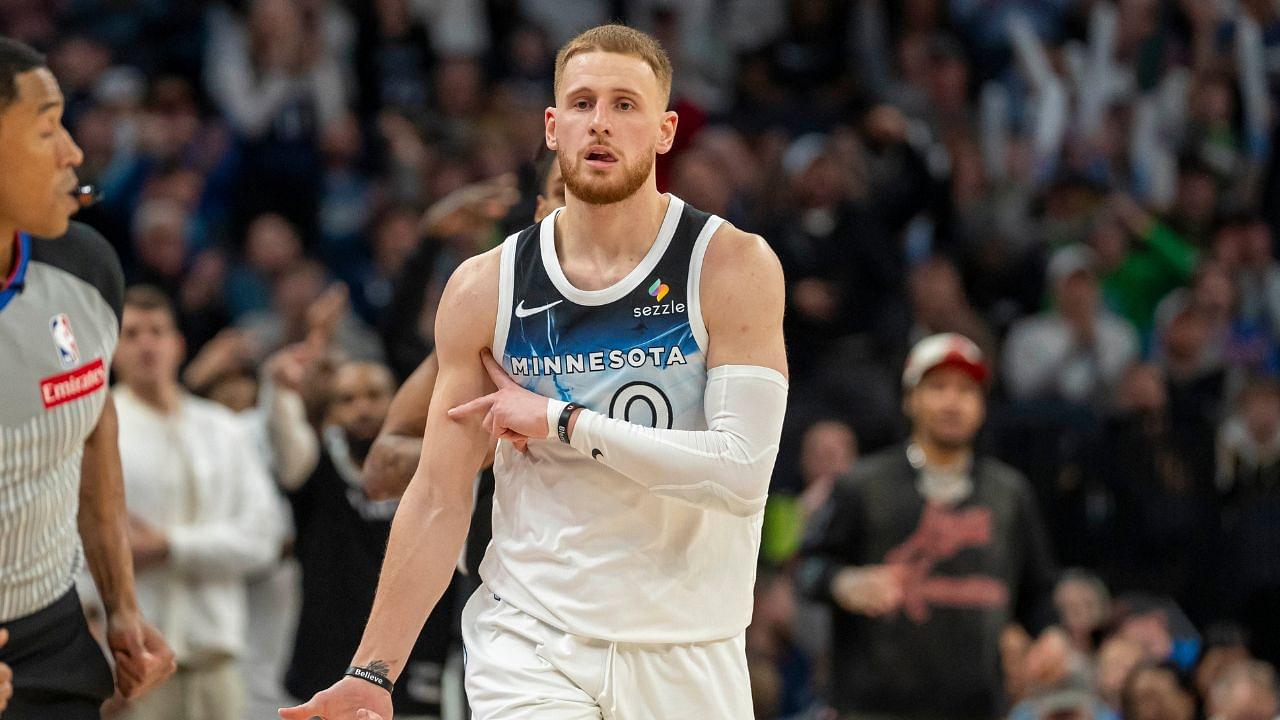 Minnesota Timberwolves guard Donte DiVincenzo (0) celebrates after making a shot against the San Antonio Spurs in the second half at Target Center.