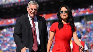 Buffalo Bills owners Terry and Kim Pegula walk on the field prior to the game against the Miami Dolphins at New Era Field.