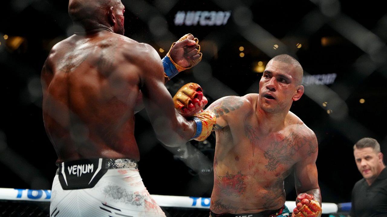 Alex Pereira (red gloves) fights Khalil Rountree Jr. (blue gloves) in a light heavyweight title bout during UFC 307 at Delta Center.