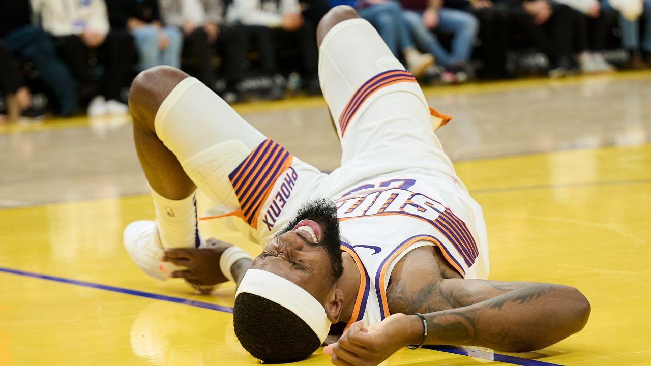 Phoenix Suns forward Ryan Dunn (0) reacts with an apparent injury against the Golden State Warriors during the second quarter at Chase Center.