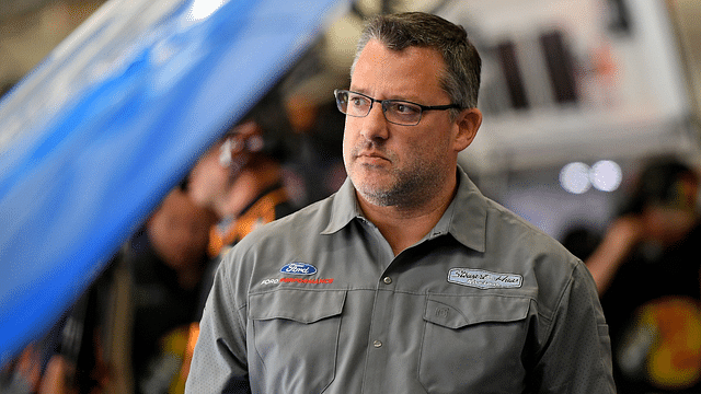 NASCAR Cup Series car owner Tony Stewart looks on in the garage during practice for the Coca-cola 600 at Charlotte Motor Speedway.