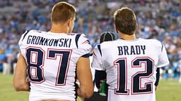 Aug 24, 2018; Charlotte, NC, USA; New England Patriots tight end Rob Gronkowski (87) talks with quarterback Tom Brady (12) during the fourth quarter against the Carolina Panthers at Bank of America Stadium.