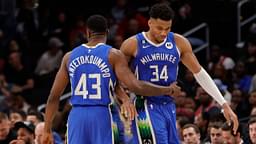 Milwaukee Bucks forward Giannis Antetokounmpo (34) hugs his brother, Bucks forward Thanasis Antetokounmpo (43), while walking off the floor against the Washington Wizards in the fourth quarter at Capital One Arena.