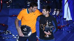 Juan Martin Del Potro of Argentina and Novak Djokovic of Serbia poses with the runner-up and championship trophies (respectively) on day fourteen of the 2018 U.S. Open tennis tournament