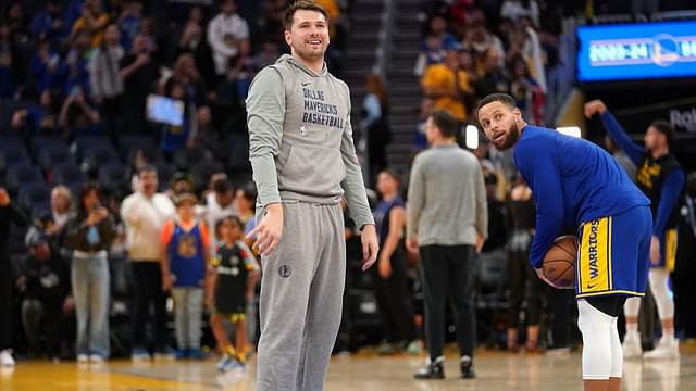 Dallas Mavericks guard Luka Doncic (77) and Golden State Warriors guard Stephen Curry (30) stand on the court during warmups at the Chase Center.