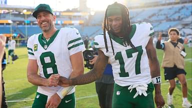 New York Jets quarterback Aaron Rodgers (8) and wide receiver Davante Adams (17) high-five each other as they walks off the field after the game Sunday, Dec. 15, 2024 at EverBank Stadium in Jacksonville, Fla. The Jets held off the Jaguars 32-25.