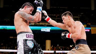 Dmitry Bivol (brown trunks) and Lenin Castillo (black trunks) box during a WBA Super World Light-Heavyweight title boxing match at Wintrust Arena.