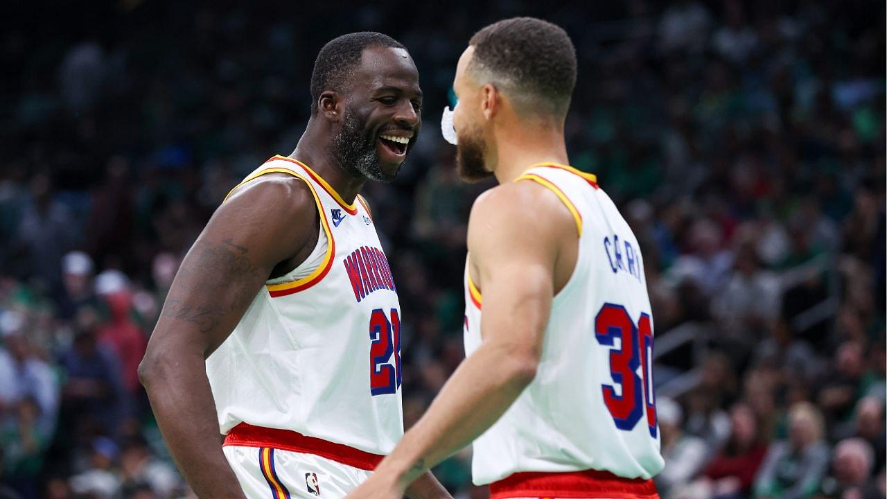 Golden State Warriors forward Draymond Green (23) and Golden State Warriors guard Stephen Curry (30) celebrate during the first half against the Boston Celtics at TD Garden.