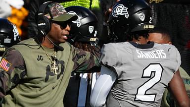 Nov 11, 2023; Boulder, Colorado, USA; Colorado Buffaloes quarterback Shedeur Sanders (2) celebrates his touchdown with head coach Deion Sanders in the first half against the Arizona Wildcats at Folsom Field.