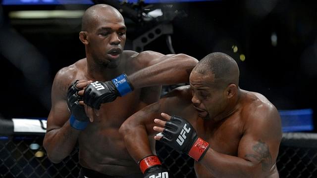 Jon Jones lands an elbow hit as Daniel Cormier defends during UFC 214 at Honda Center.