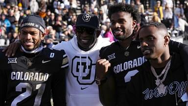 Colorado Buffaloes safety Shilo Sanders (21) and head coach Deion Sanders and quarterback Shedeur Sanders (2) and social media producer Deion Sanders Jr. following the win against the Oklahoma State Cowboys at Folsom Field.