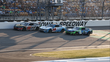 NASCAR Cup Series driver Noah Gragson (10), Todd Gilliland (38) and driver Kyle Busch (8) race three wide during the Iowa Corn 350 at Iowa Speedway.